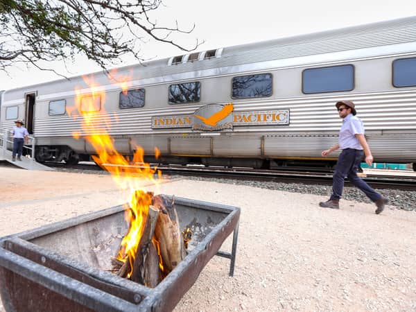 A fire pit beside the Indian Pacific's carriages at Rawlinna