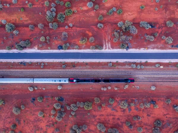 Looking straight down on the Ghan on red earth near Marla, South Australia