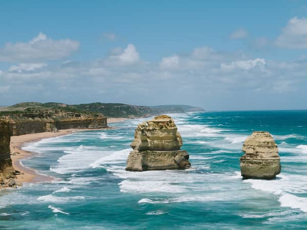 Limestone stacks of the Twelve Apostles rising from the surf
